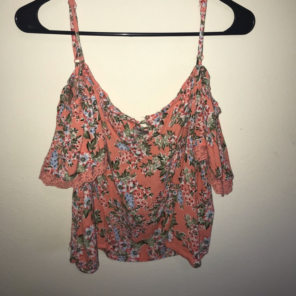 Peach off-the-shoulder flowing crop top.